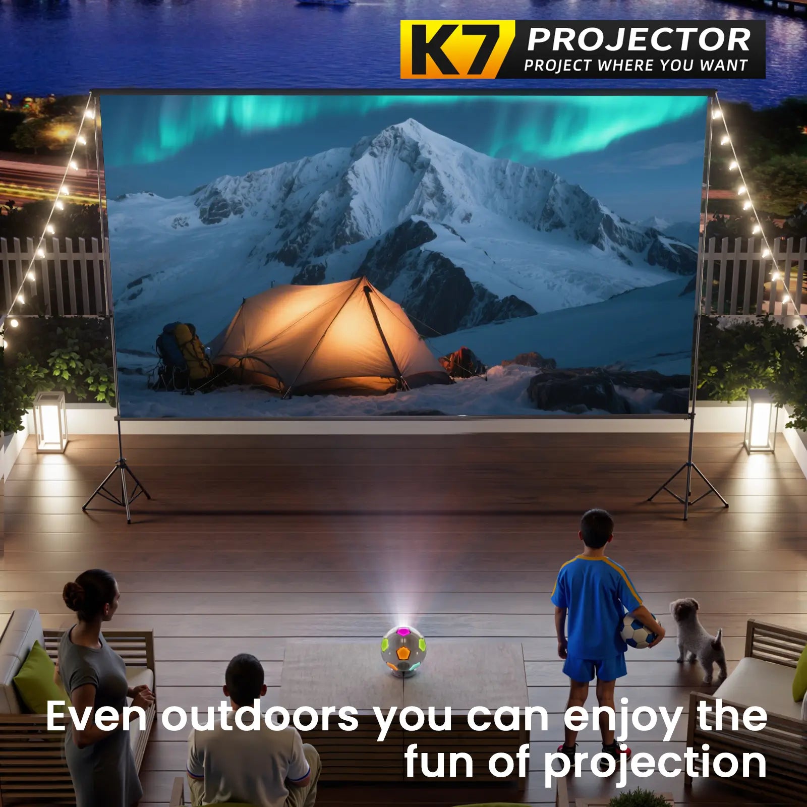 A family enjoys an outdoor movie night on their patio, watching a nature scene projected by the portable K7 projector.