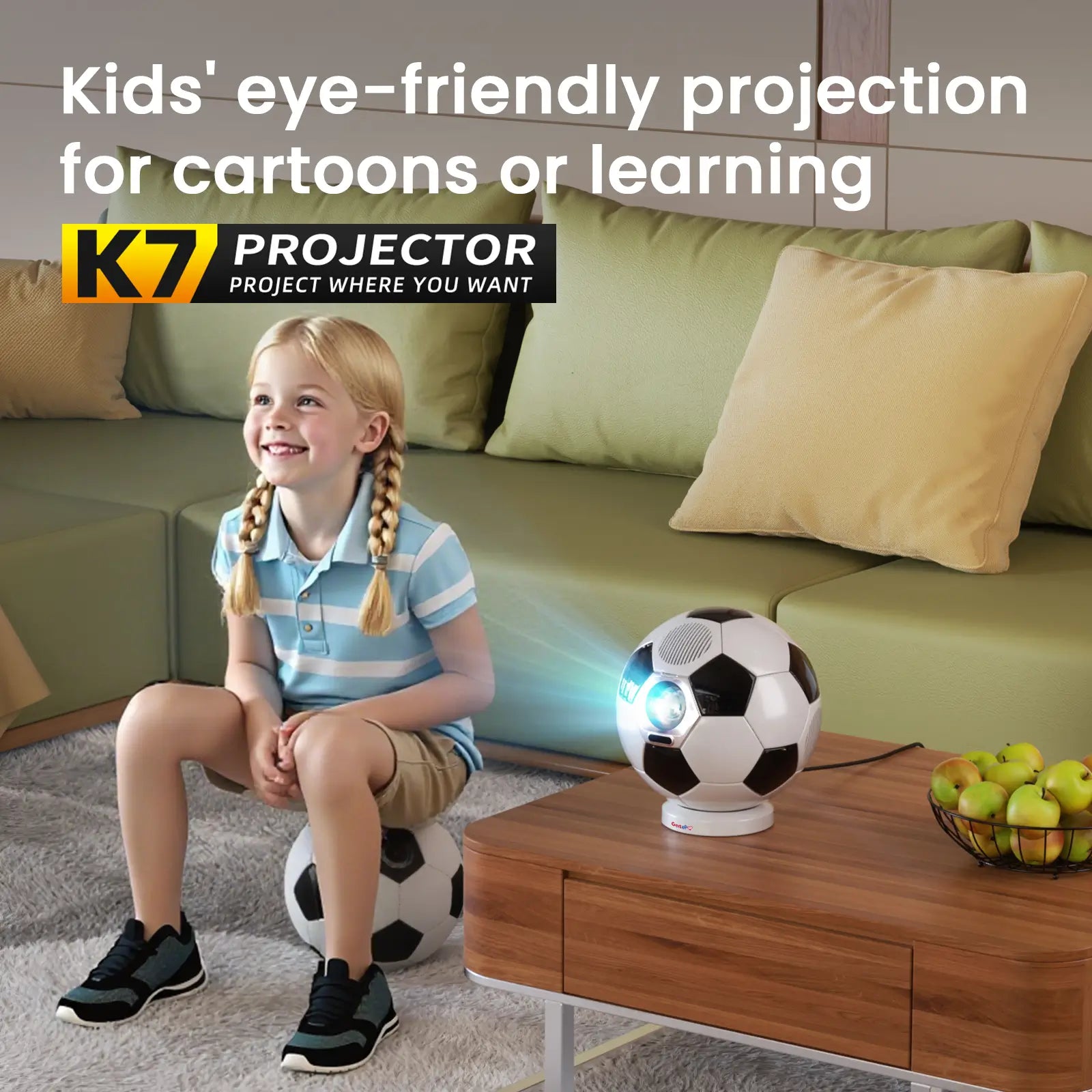 A young girl happily watching cartoons on the K7 projector, highlighting its kid-friendly, eye-safe projection technology for learning and fun.