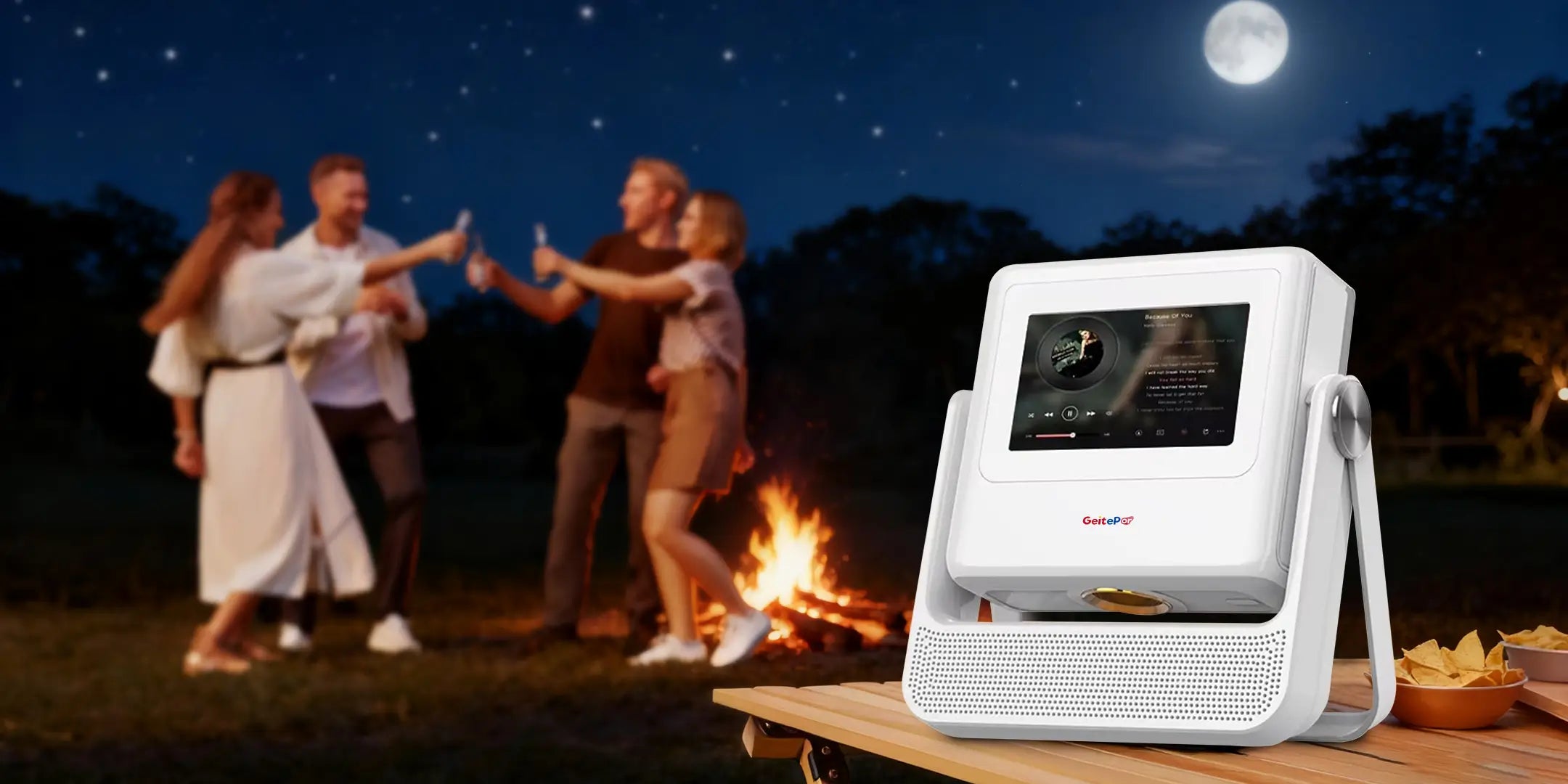 Geitepor A5PRO smart projector used outdoors at night party with friends under the moonlight