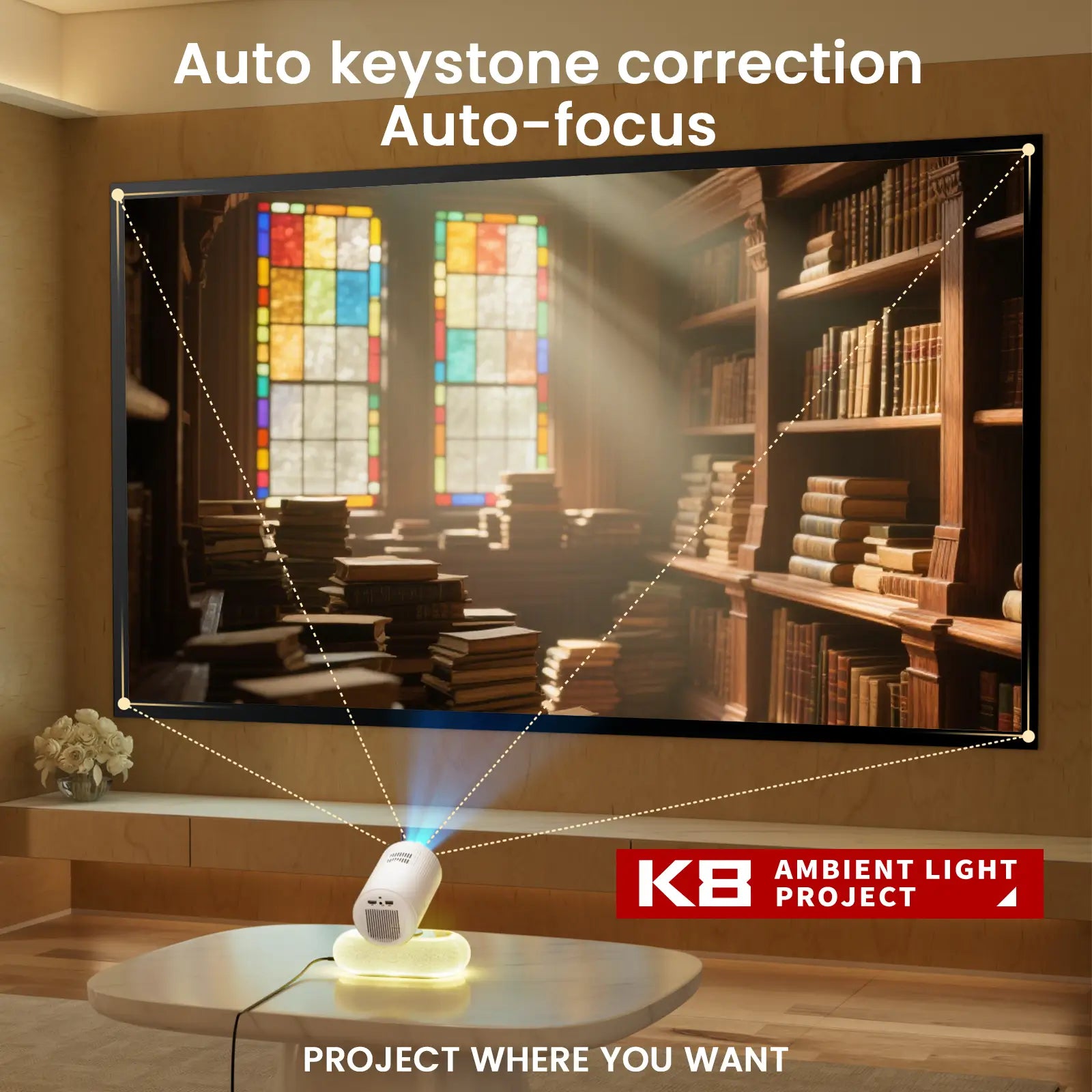 A living room scene demonstrating the Geitepor K8 projector's auto keystone correction and auto-focus feature, casting a perfectly rectangular image of a library onto a large screen.