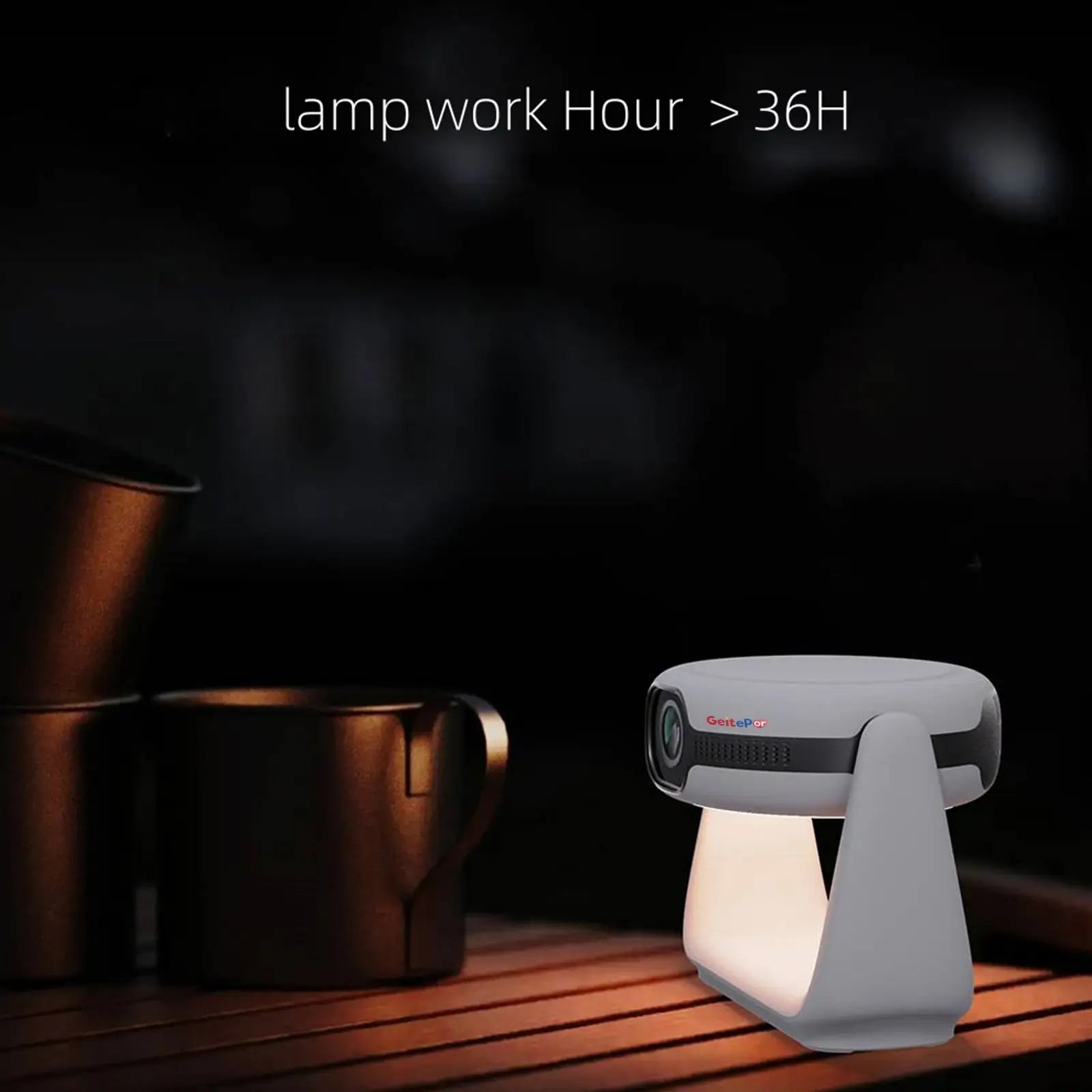 The K1 projector being used outdoors as an ambient table lamp, with text highlighting the lamp's long-lasting battery life of over 36 hours.